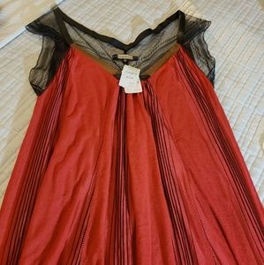 A Rozae Nichols red dress meant to be seen